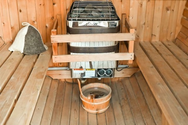 Outdoor barrel sauna with eucalyptus oil provided. 