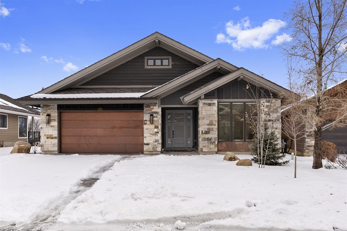 Welcome to your modern mountain getaway—beautiful curb appeal in a peaceful setting.