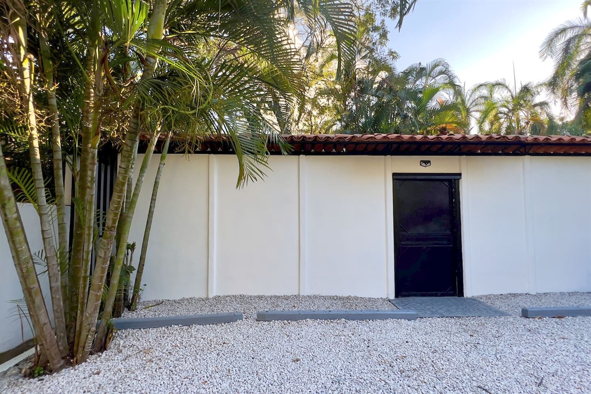 Casa Cocos parking area outside entrance gate.  