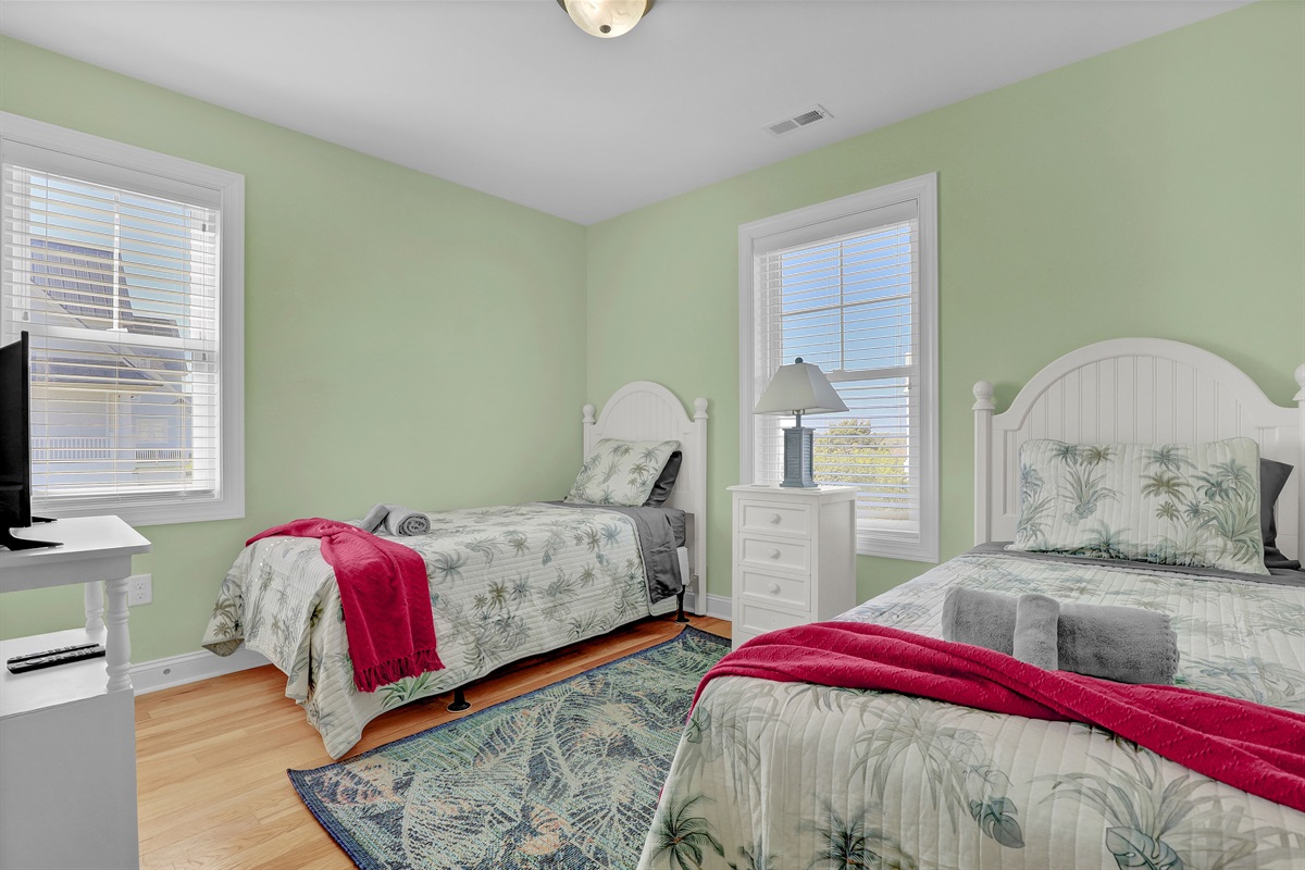 Charming twin guest room—perfect for kids or friends sharing a space.