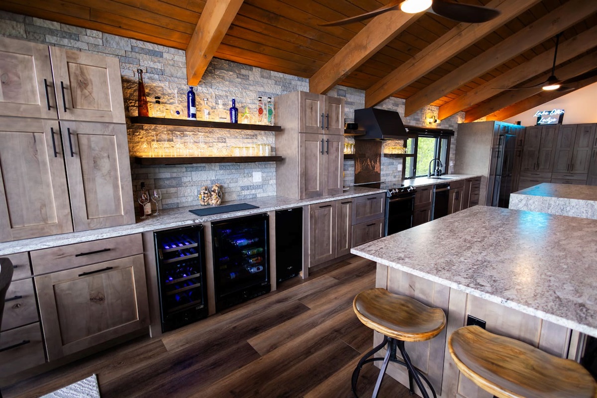 Bar area with wine and beverage fridge and full ice maker so you never run out of ice - Just bring your favorite spirits & mixers!