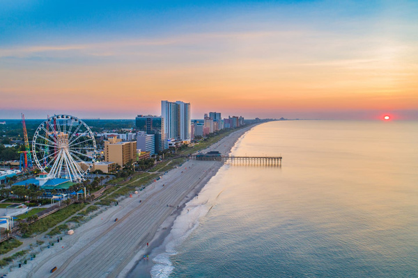 Scenic View: Breathtaking sunsets and beach fun await just steps from your door!