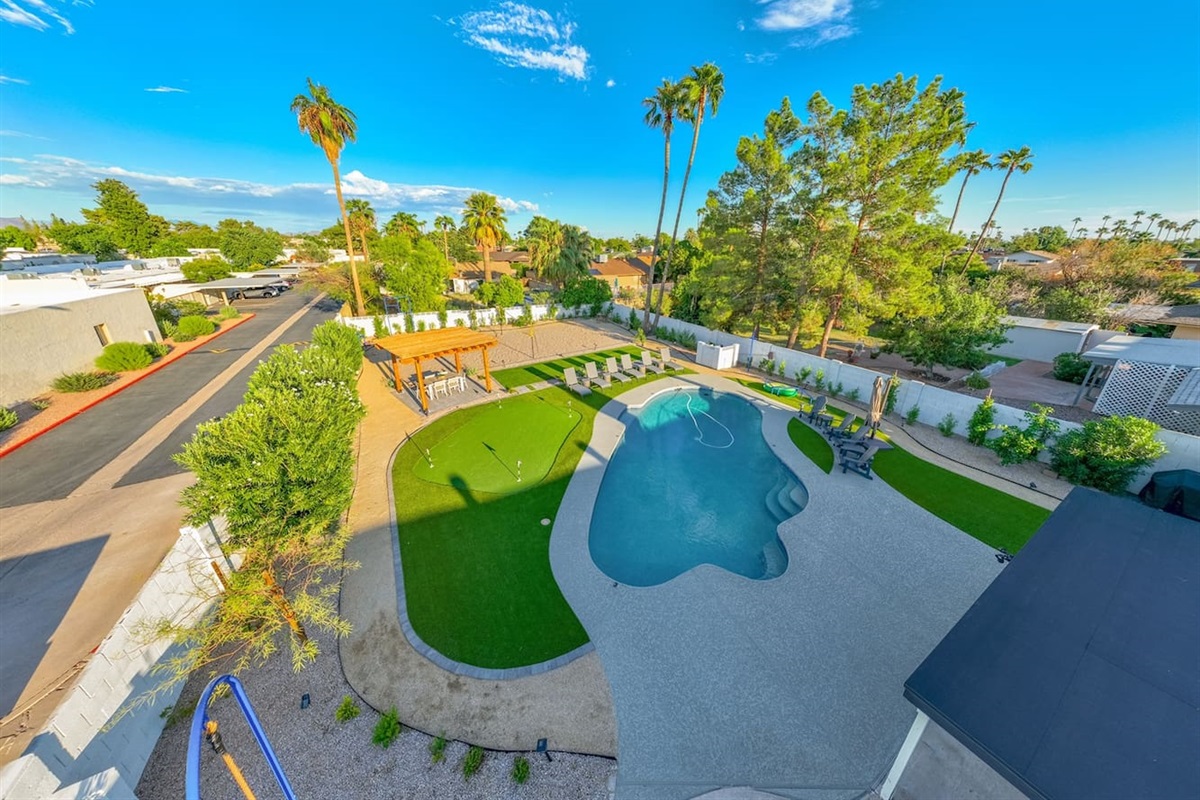 This expansive backyard offers something for everyone, making it the perfect setting for outdoor gatherings and adventures.