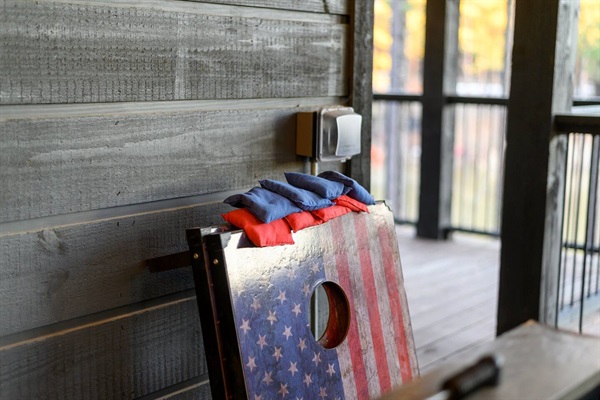 Experience fun-filled moments with this patriotic cornhole board, ready for a classic outdoor game on the cabin’s spacious deck. Ideal for family vacations and group stays.