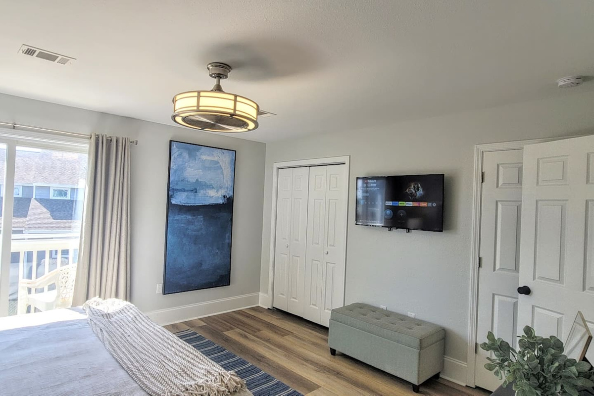 Stream your favorites on the Smart TV from the comfort of a king bed &mdash; vacation mode: on.
