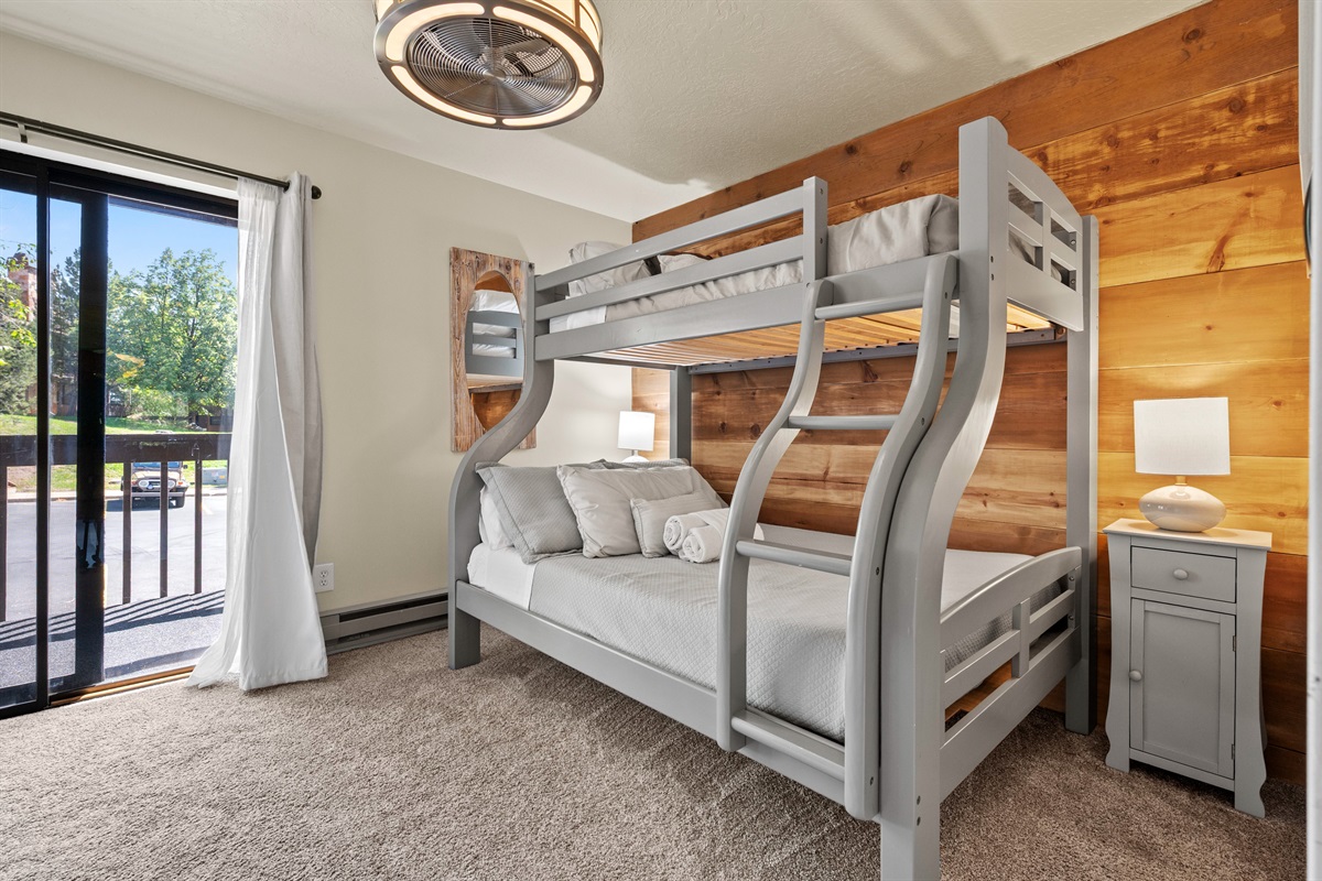 Bunk room with balcony access.