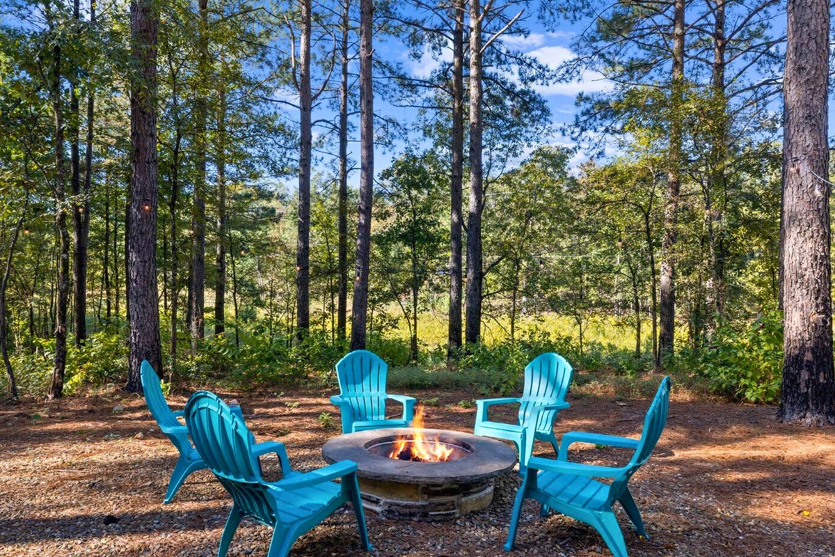 Warmth and woodland whispers meet at our cozy outdoor firepit.
