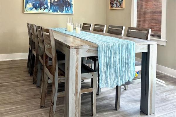 Dining table with seating for 8Dimmable chandelierOriginal art throughout