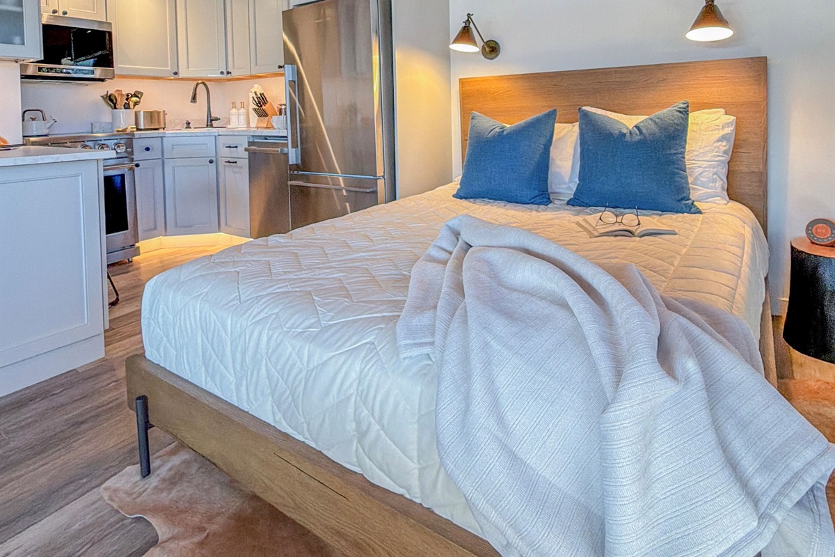 The main level queen bed has a luxury mattress which invites you to enjoy a beautiful night of rest.