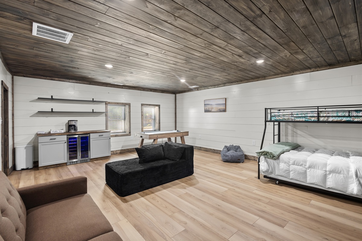 Game Room with twin over full bunk bed with trundle and couch that makes into a bed