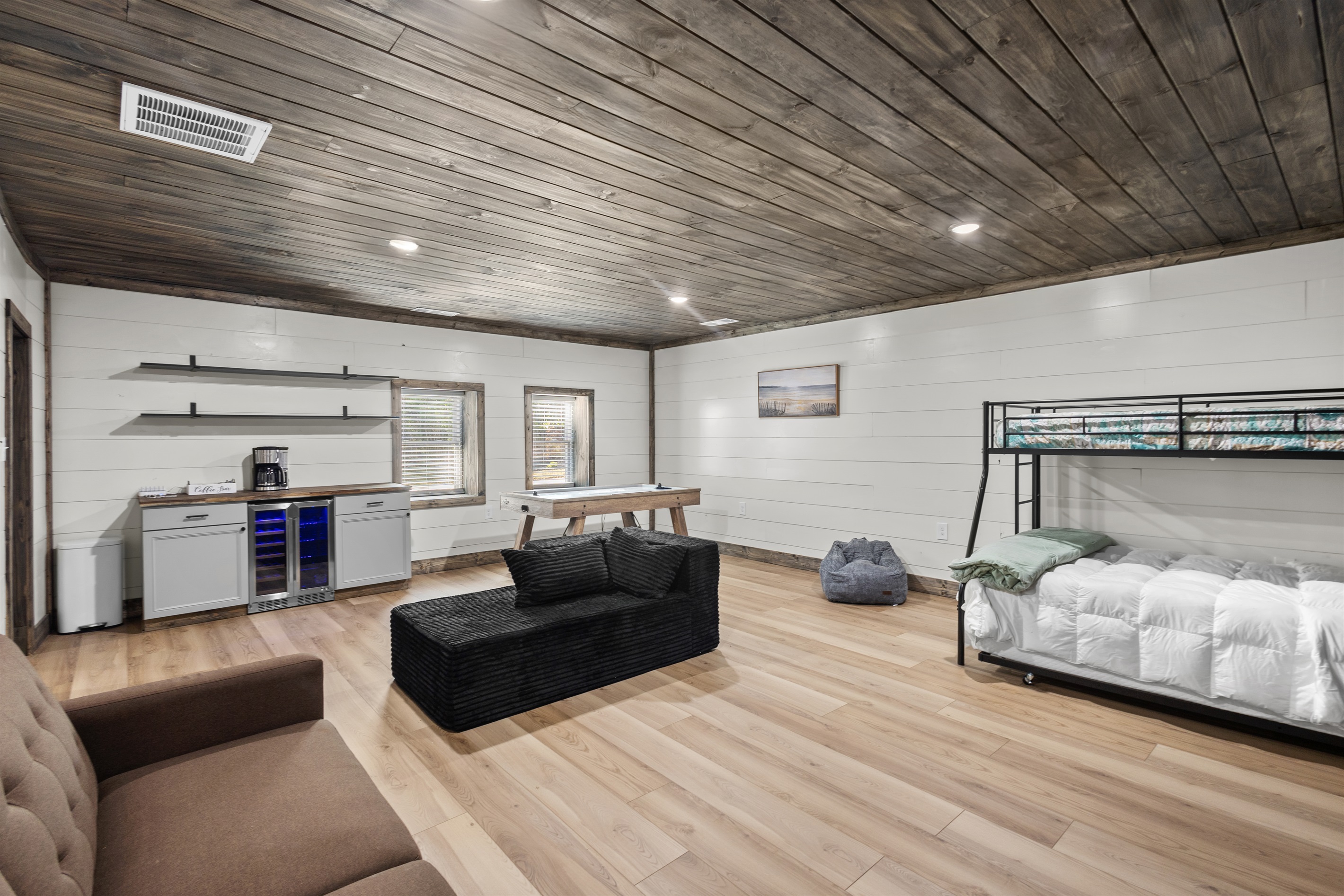 Game Room with twin over full bunk bed with trundle and couch that makes into a bed