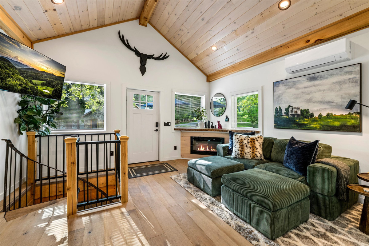 Cozy Living Room with 55-inch Smart TV, Fireplace, and bistro table.
