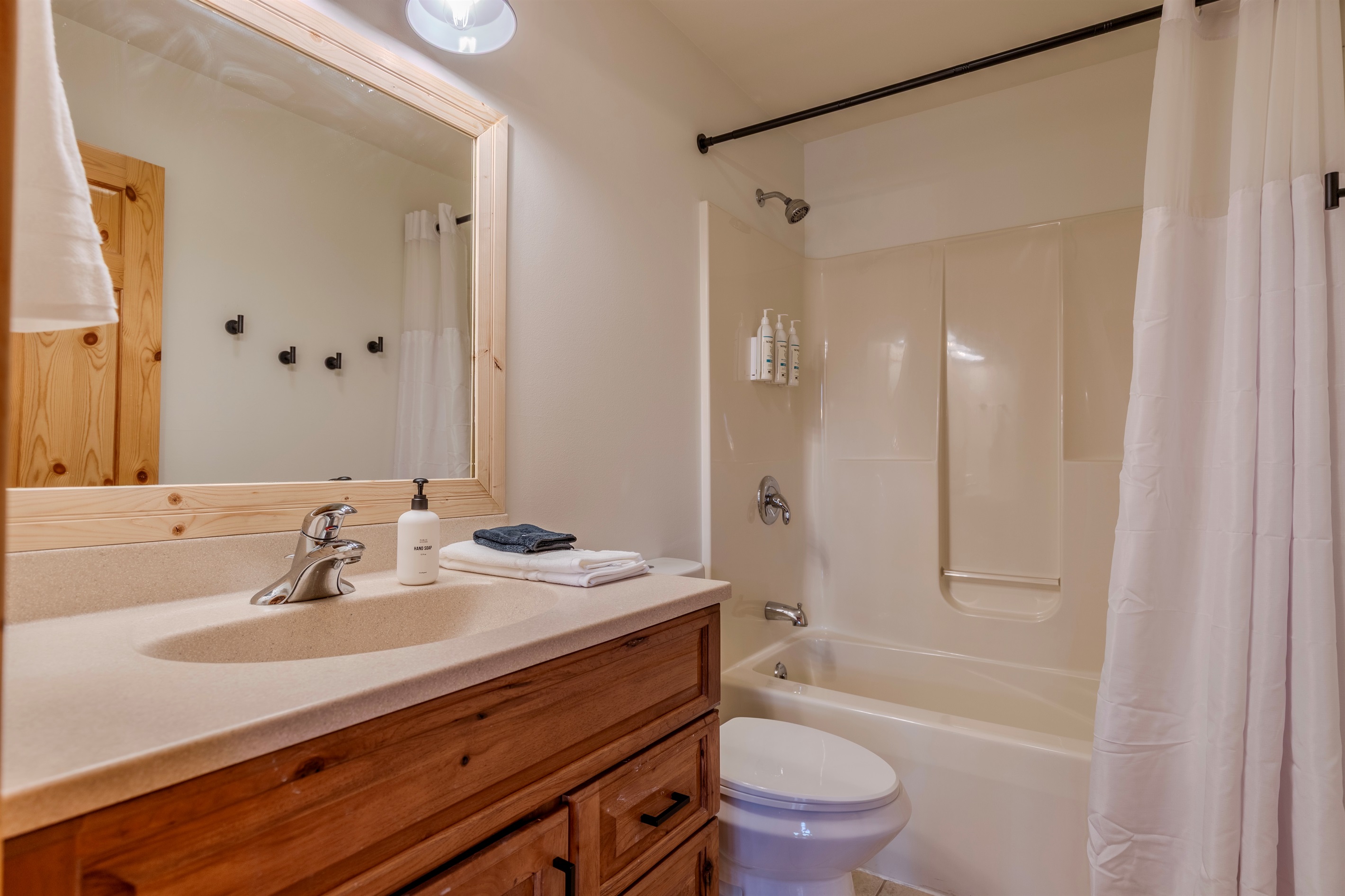 Upstairs bathroom with shower/tub combo.  Shampoo, conditioner and body wash are provided during your stay.