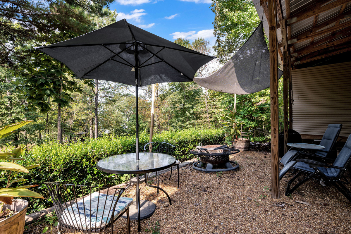 Shaded outdoor dining space for coffee, meals, or evening drinks