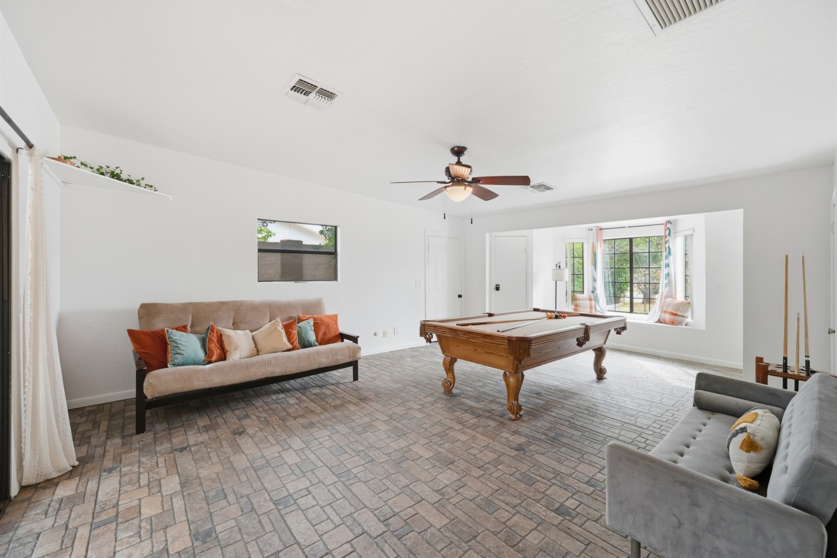 This room features a full-size pool table, cozy lounge seating, and warm Southwestern charm for hours of laid-back entertainment.