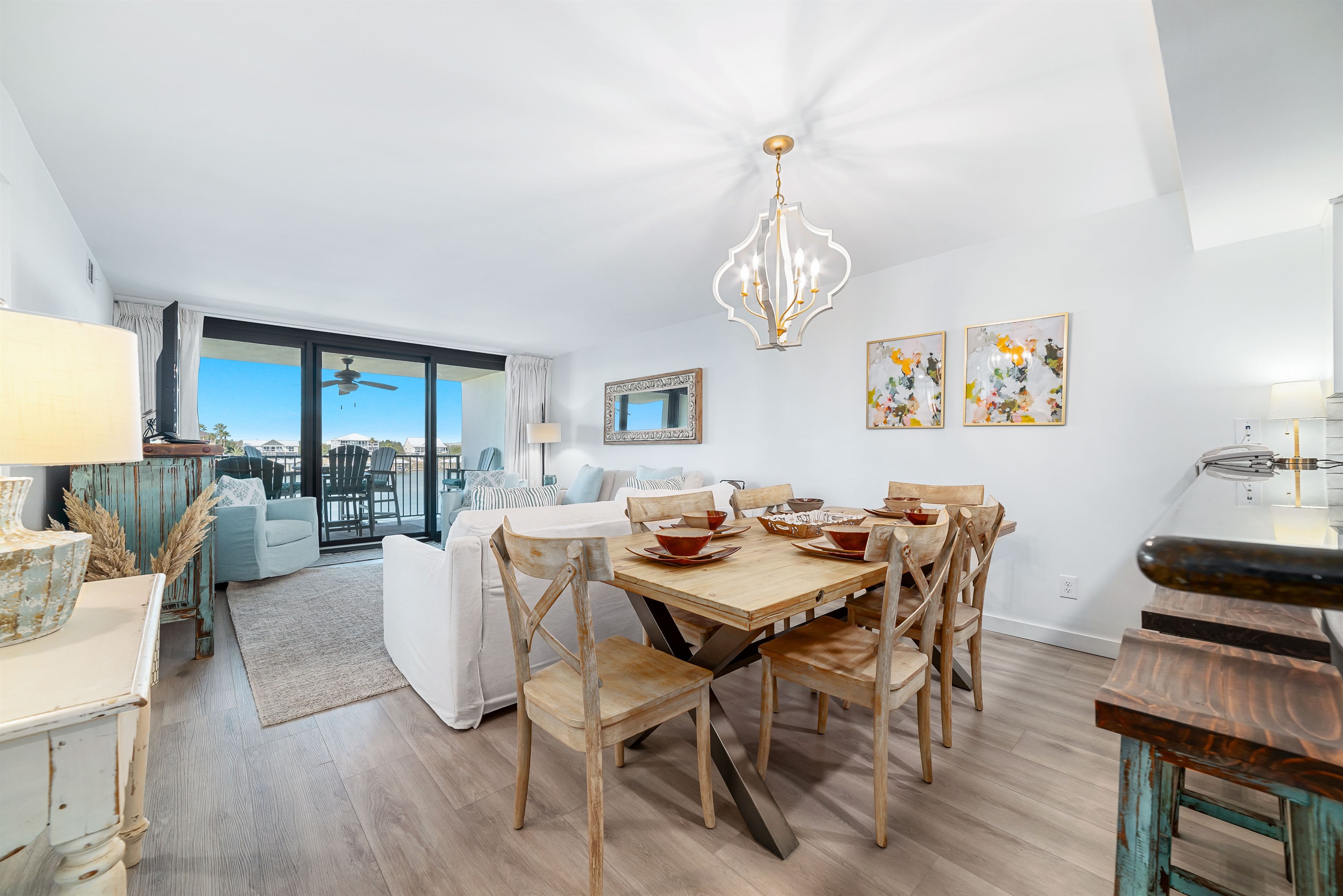 Dine in style with ample space for everyone. This inviting dining area features a charming table for family meals, complemented by additional seating at the convenient breakfast bar.