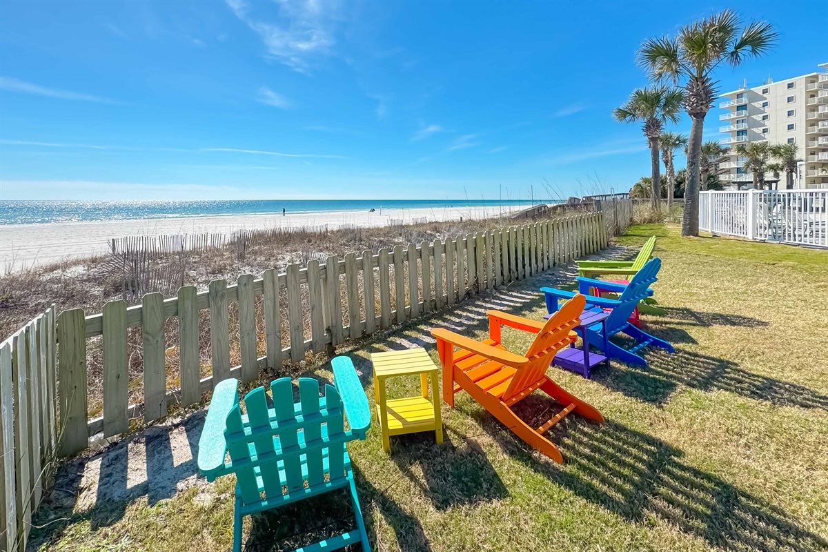 Gain a new perspective on coastal beauty with this panoramic view.  Witness the vastness of the beach and the shimmering sea.