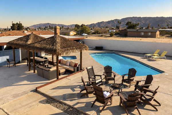 Backyard oasis: private pool, palapa lounge and fire pit seating in the high desert