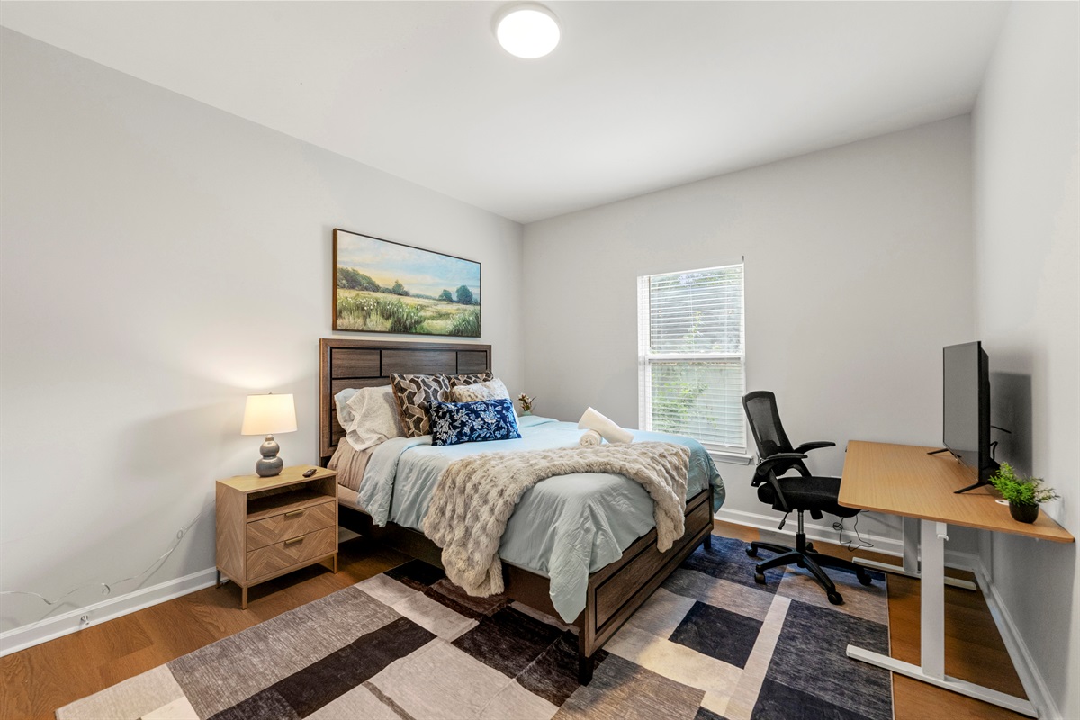 Bright and cozy bedroom offering comfort and simplicity for a restful stay.