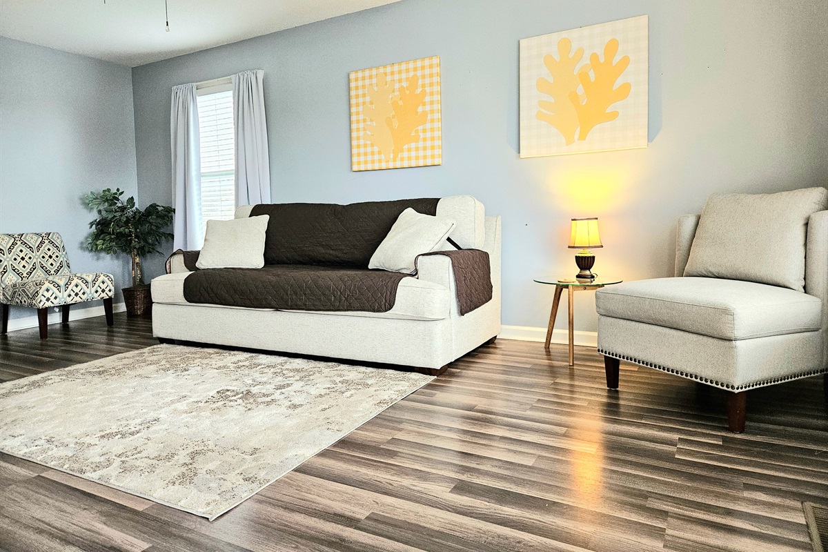 Spacious living room with elegant features and comfortable seating. High Speed WIFI, smart TV and keyless entry included.