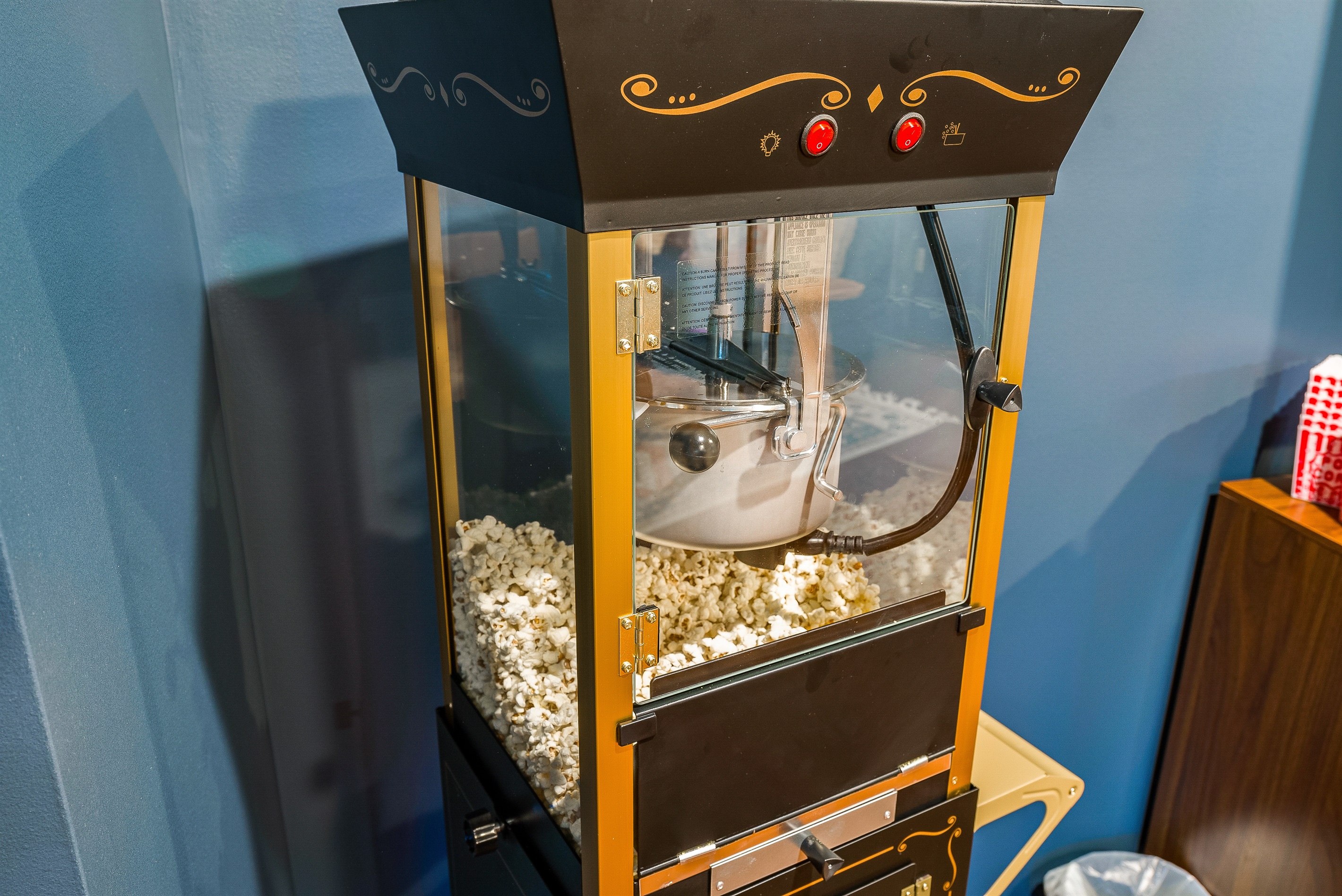 A retro-style popcorn machine completes the movie night vibe—just add your favorite film.