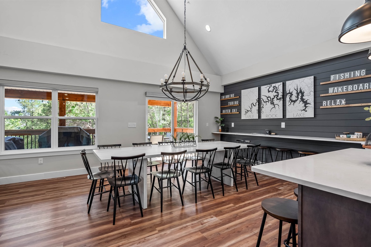 Walk out onto the upper deck with more seating and a propane grill