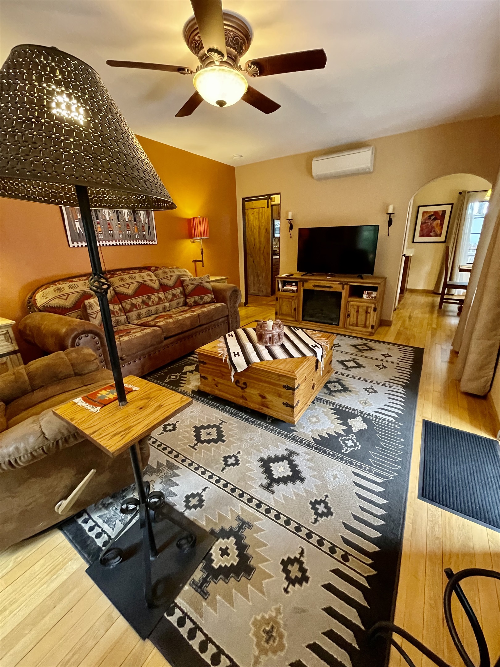 Southwestern style living room with comfy seating and unique decor.