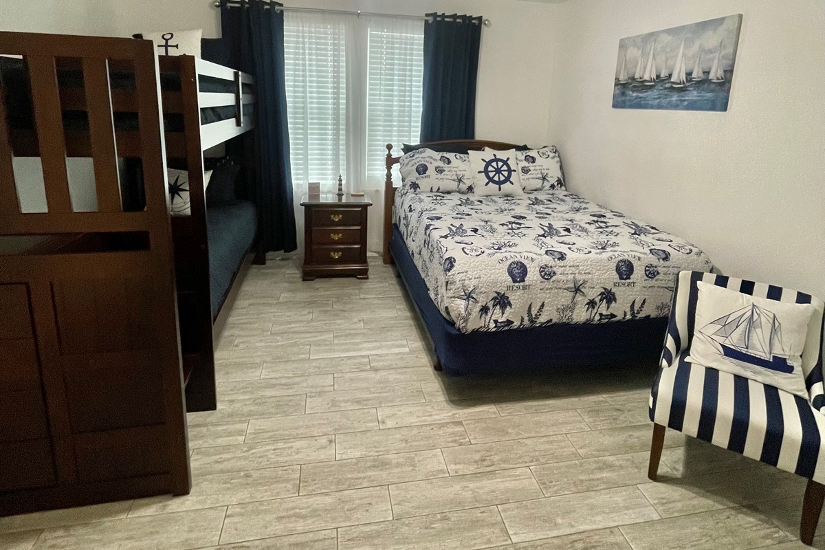 Queen bed and bunk beds, room darkening curtains for sleeping in after a long day at the beach