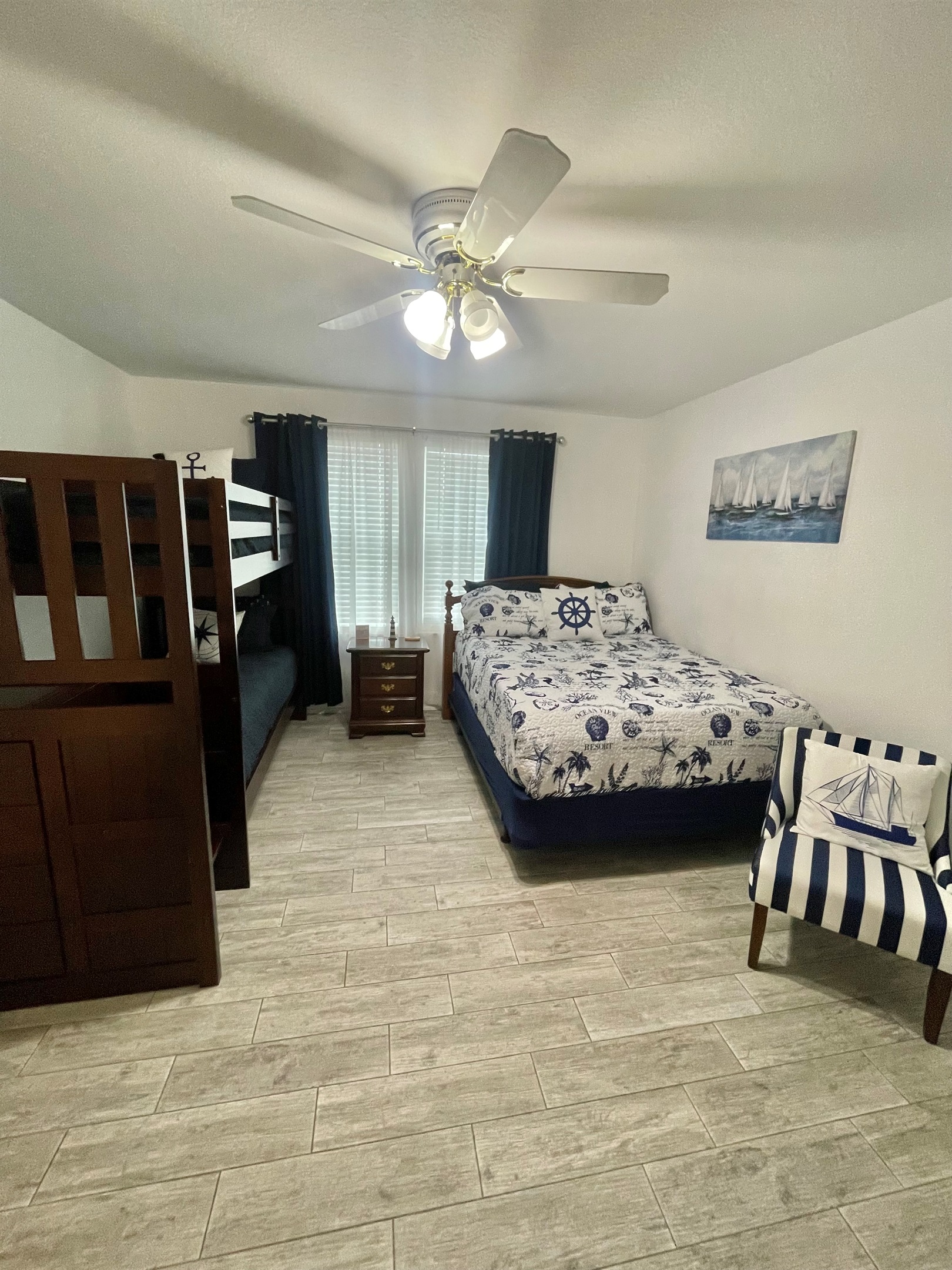 Queen bed and bunk beds, room darkening curtains for sleeping in after a long day at the beach