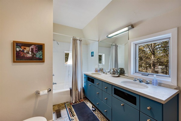 2nd upstairs bathroom. Tub and shower, Door County stone counter top.