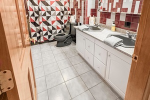 bathroom with 2 vanities and mirrors