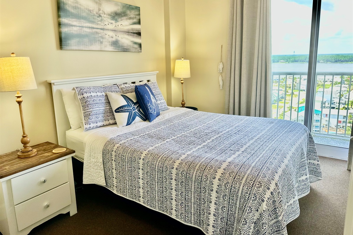 Here's our queen guest bedroom with bay views!