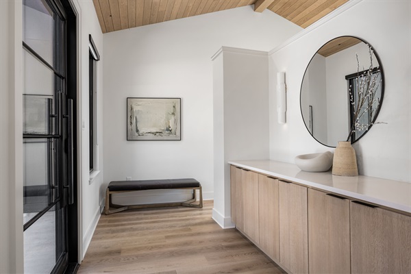 A warm, modern entryway that welcomes you in with calming tones and clean design.