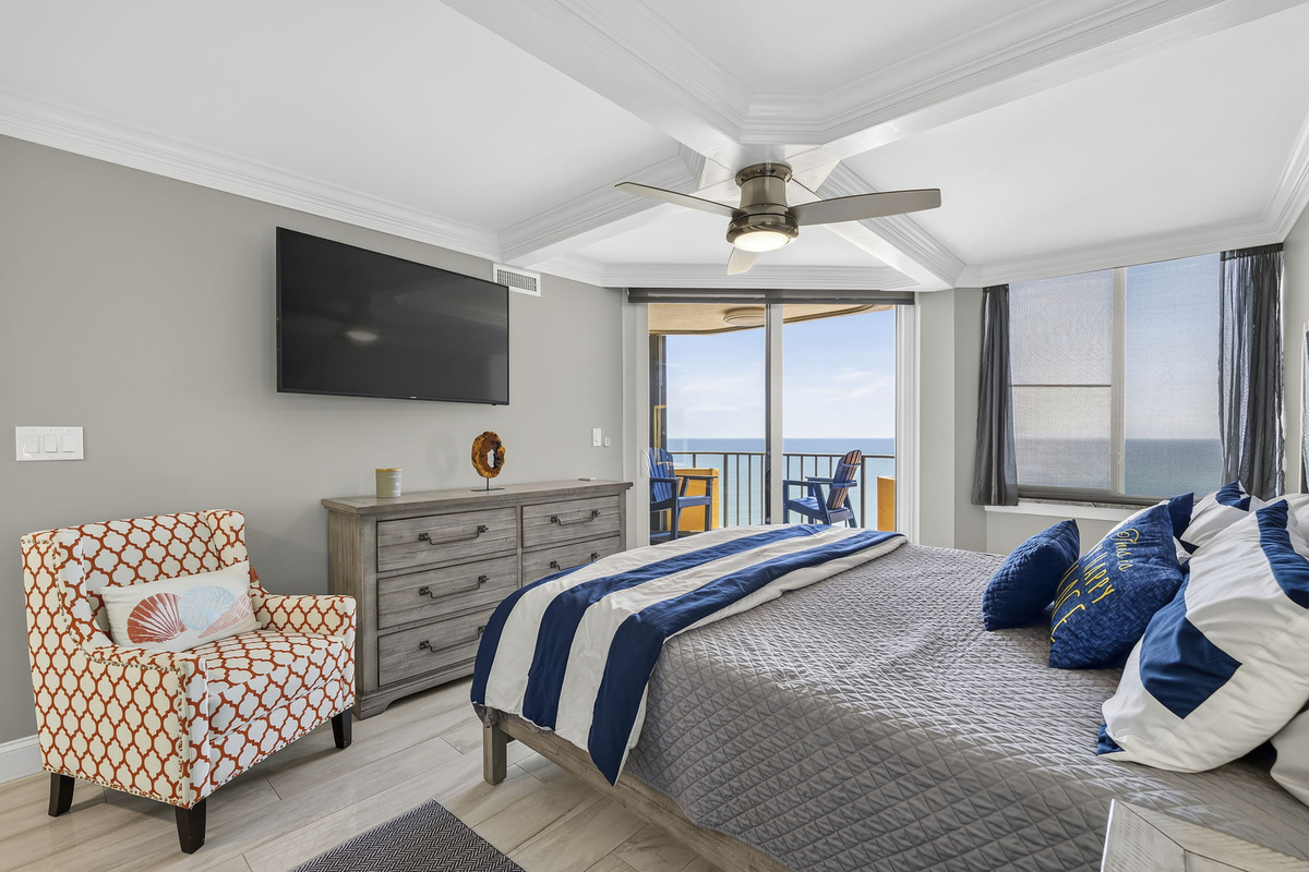 Primary bedroom with King Bed, ensuite bathroom and a private oceanfront balcony
