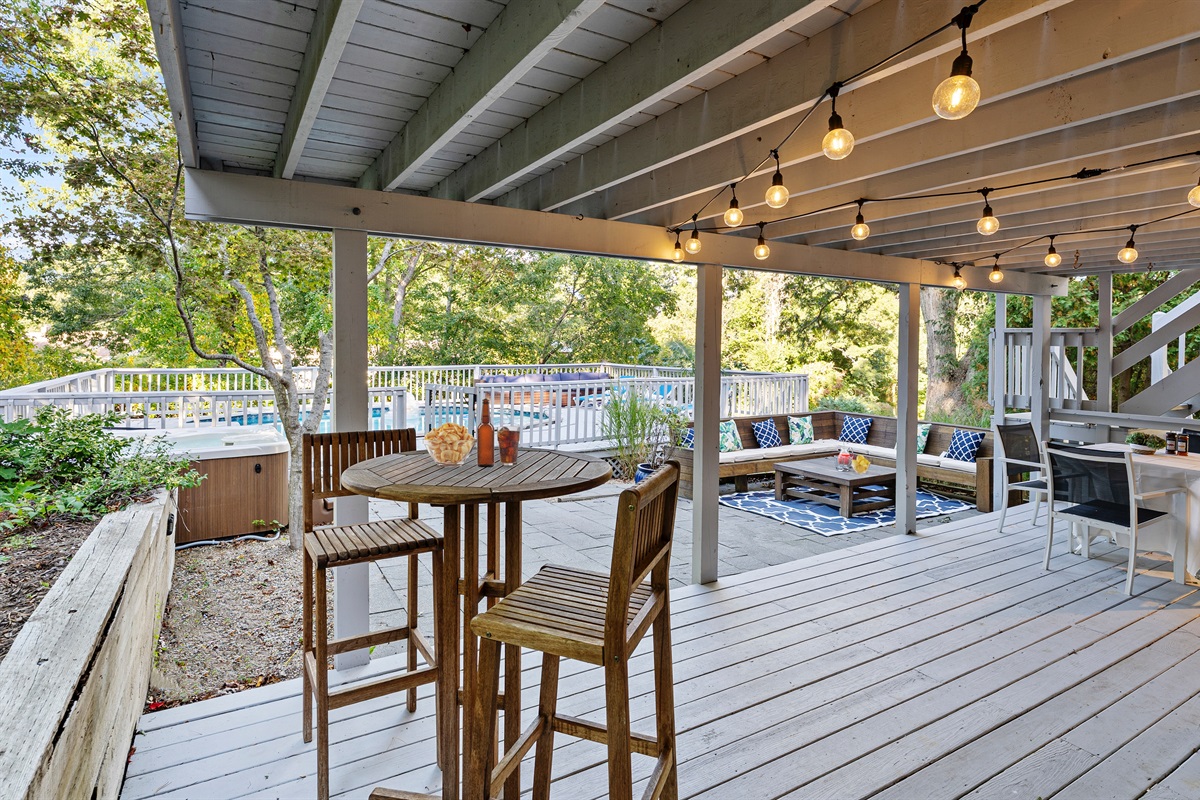 Unwind and enjoy the fresh air in your cozy outdoor sitting area, perfect for lounging.