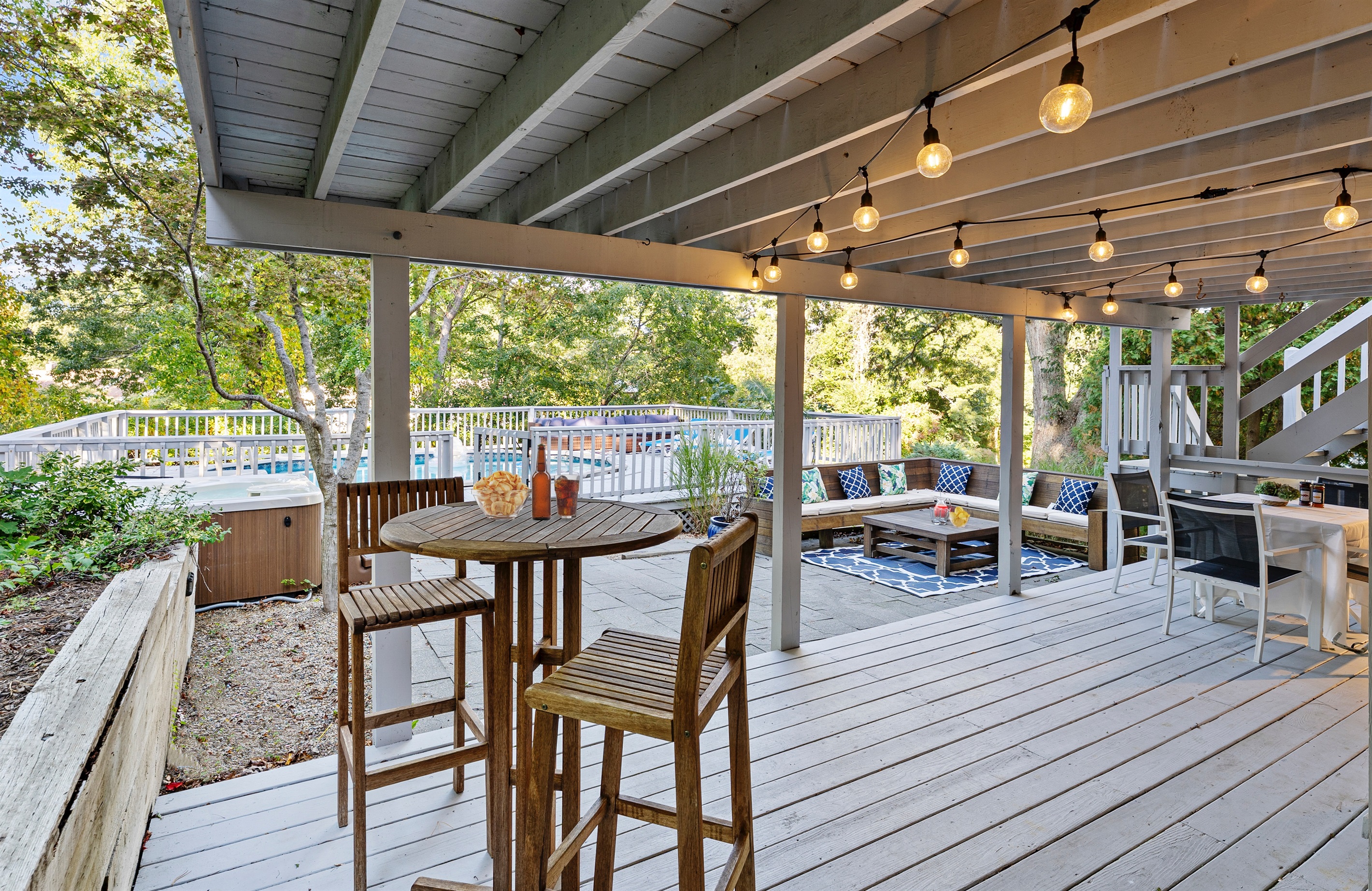 Unwind and enjoy the fresh air in your cozy outdoor sitting area, perfect for lounging.