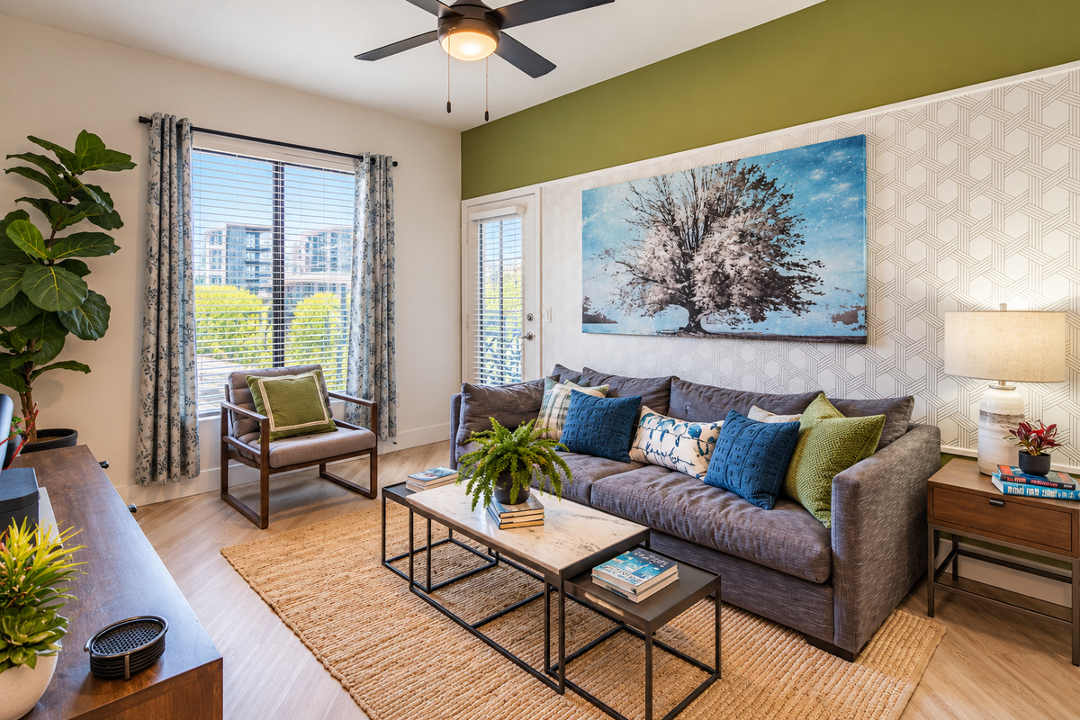 - Enjoy an open-concept living area filled with natural light and charm   - Modern accents and green tones create a refreshing atmosphere   - Perfect for relaxing or connecting with friends after a fun day out