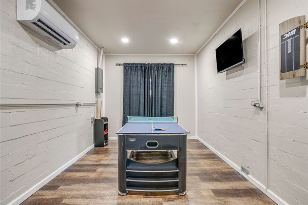 Watch the game or play one—game room with smart TV and space to lounge