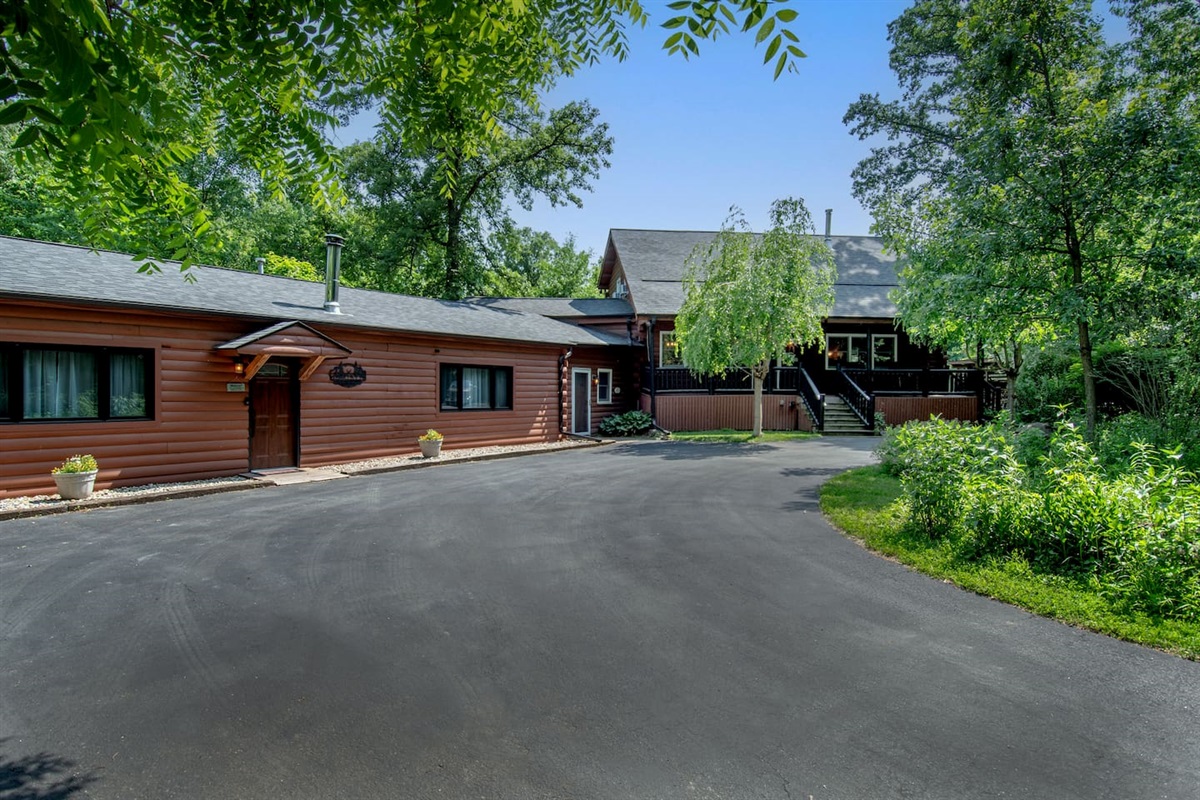 The Guest Quarters on the left can be rented out by other guests. The log cabin is on the right. They are separated by a share sunroom.