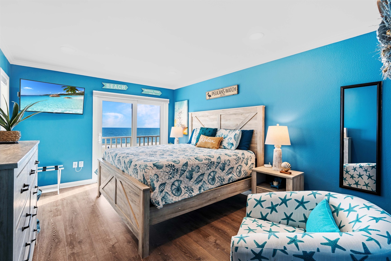 Settle into the inviting king bed of the primary bedroom with a private balcony