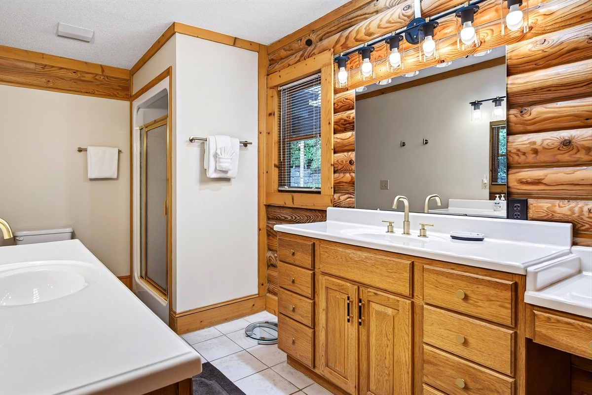 Master bathroom features 2 separate vanities and a shower.