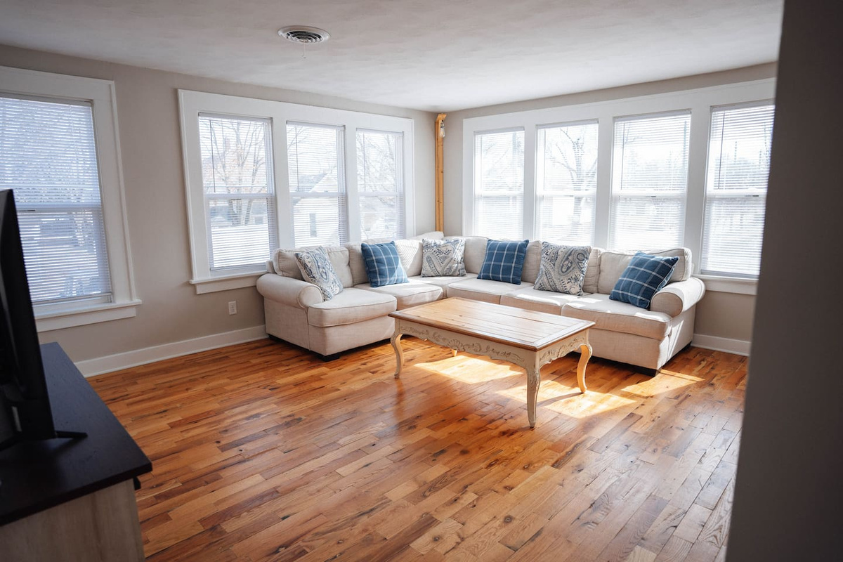 Kick back on the comfy couch, put your feet up on the coffee table, and enjoy your favorite shows on the smart TV. It’s a great spot to relax, hang out, and unwind after a long day.