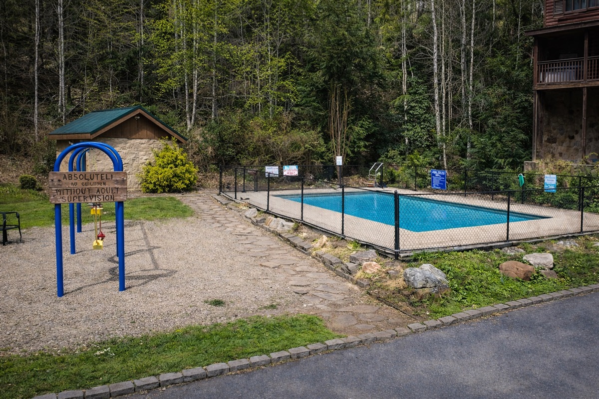 Resort pool and playground short walking distance from the cabin.