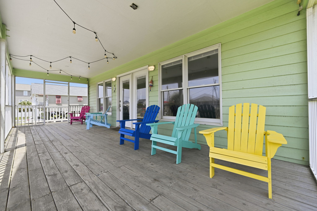Large wraparound porch with plenty of seating, ideal for gathering with family and friends