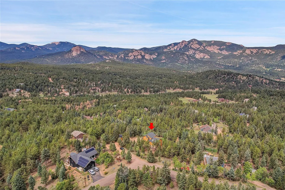 Sweeping panoramic views of the surrounding mountains and valleys from above.