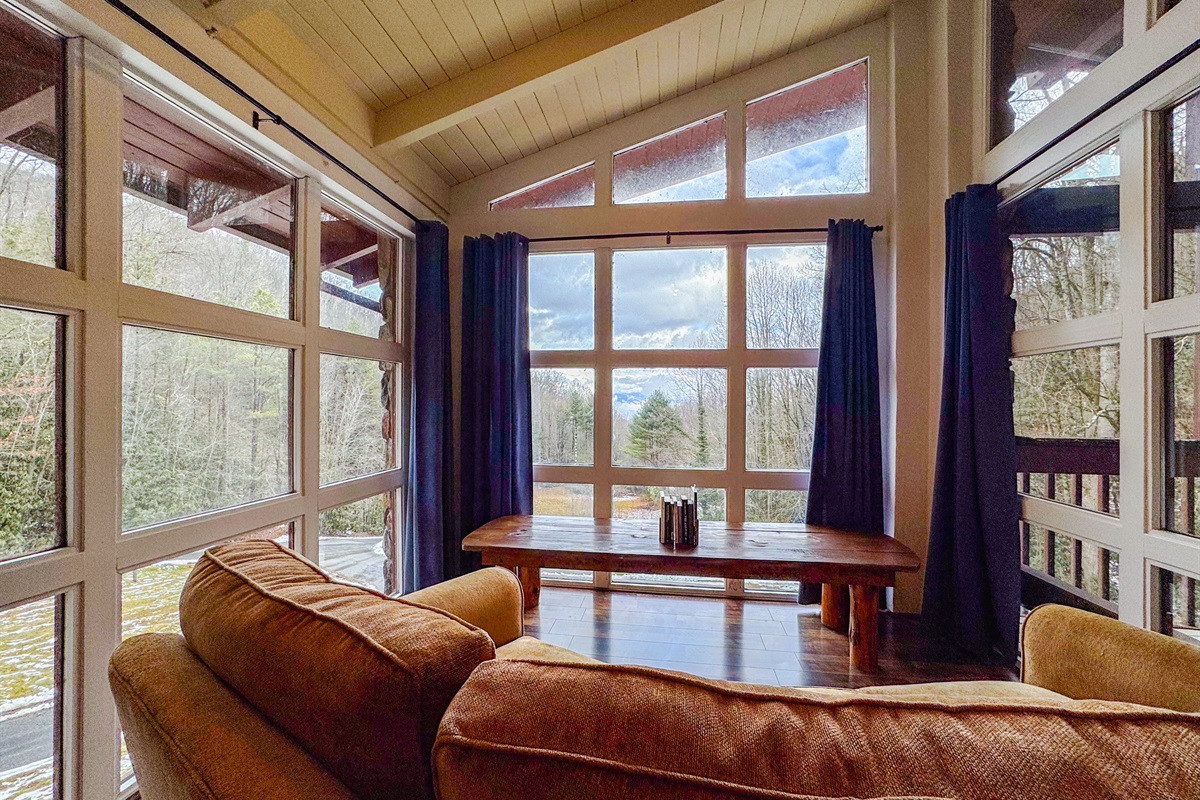 reading and sitting area overlooking the pond and Great Smoky Mountains
