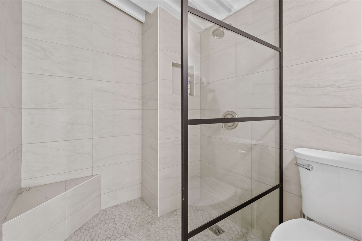 Guest ensuite bathroom with large vanity and closet space