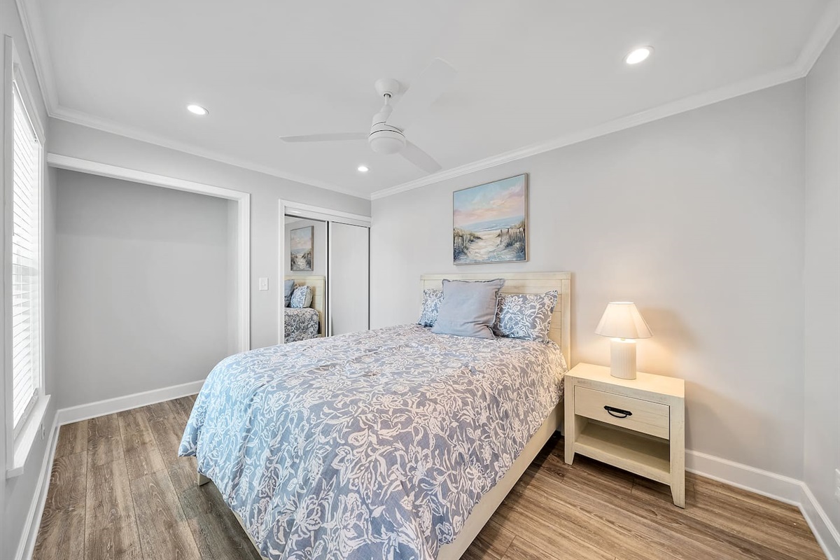 Guest room of Unit A with a queen bed. 