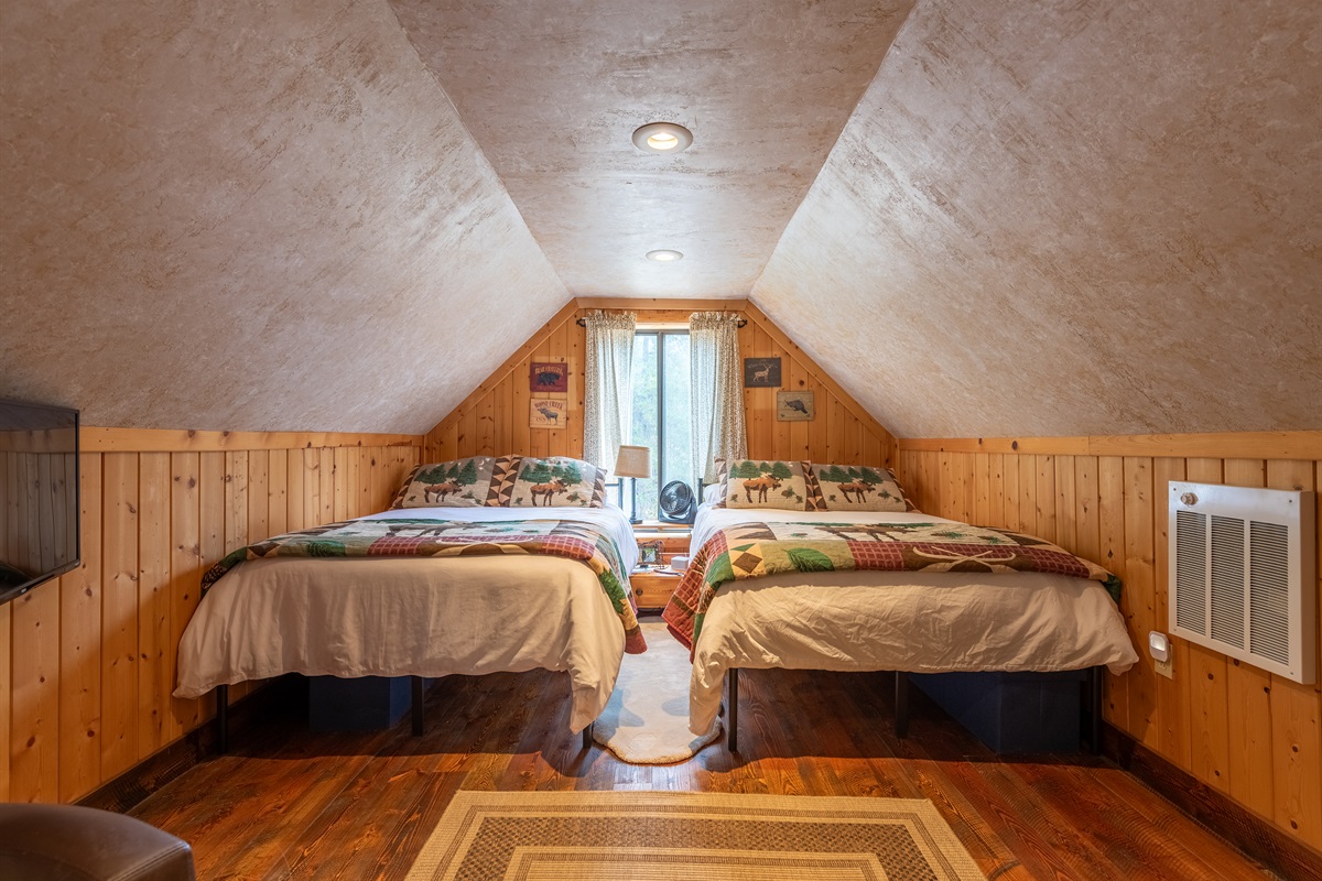Third bedroom over the garage with full beds.