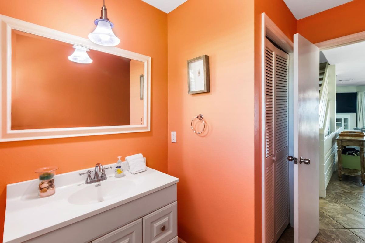 Find all the details on the main level half bath &mdash; tight but fully functional for a group coming in from the beach.